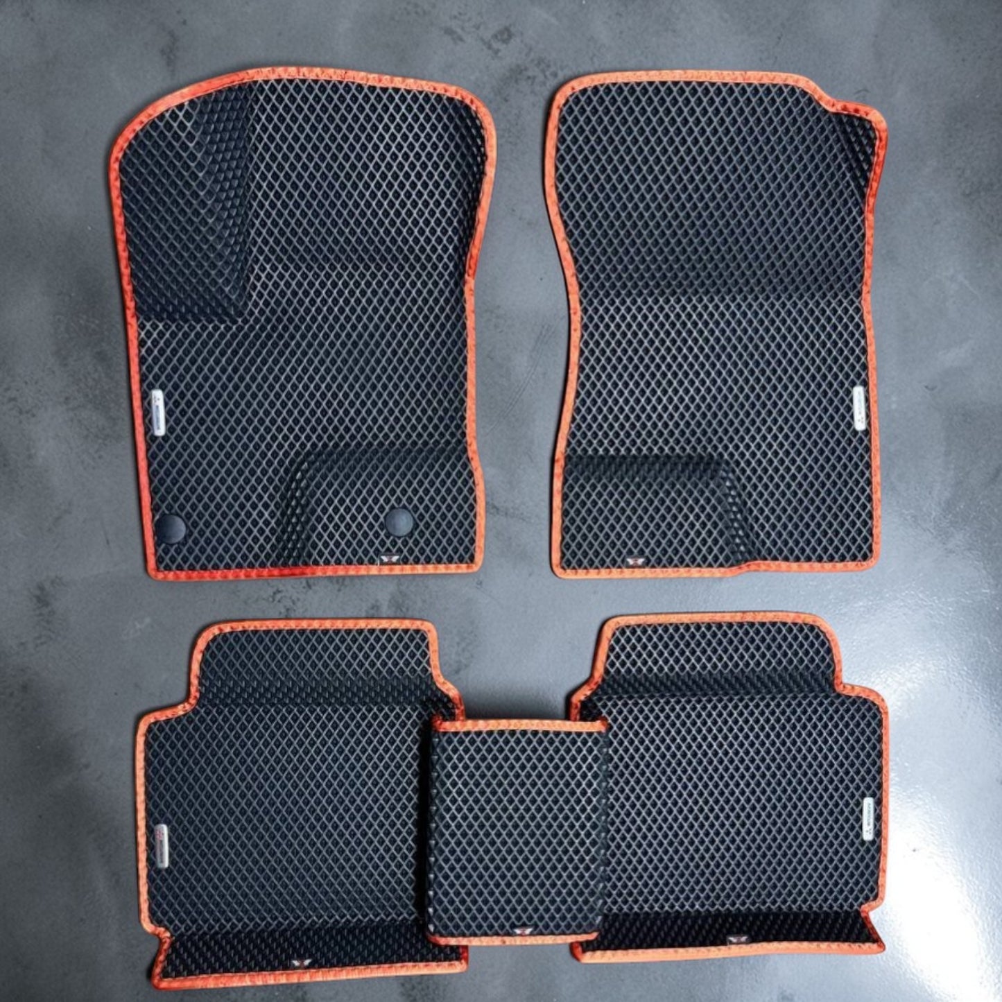 Premium custom EVA car mats full set for Mitsubishi Outlander PHEV 2022–2025, black EVA material with orange trim. Durable, waterproof, easy-to-clean all-weather floor liners designed for perfect fit and maximum interior protection.